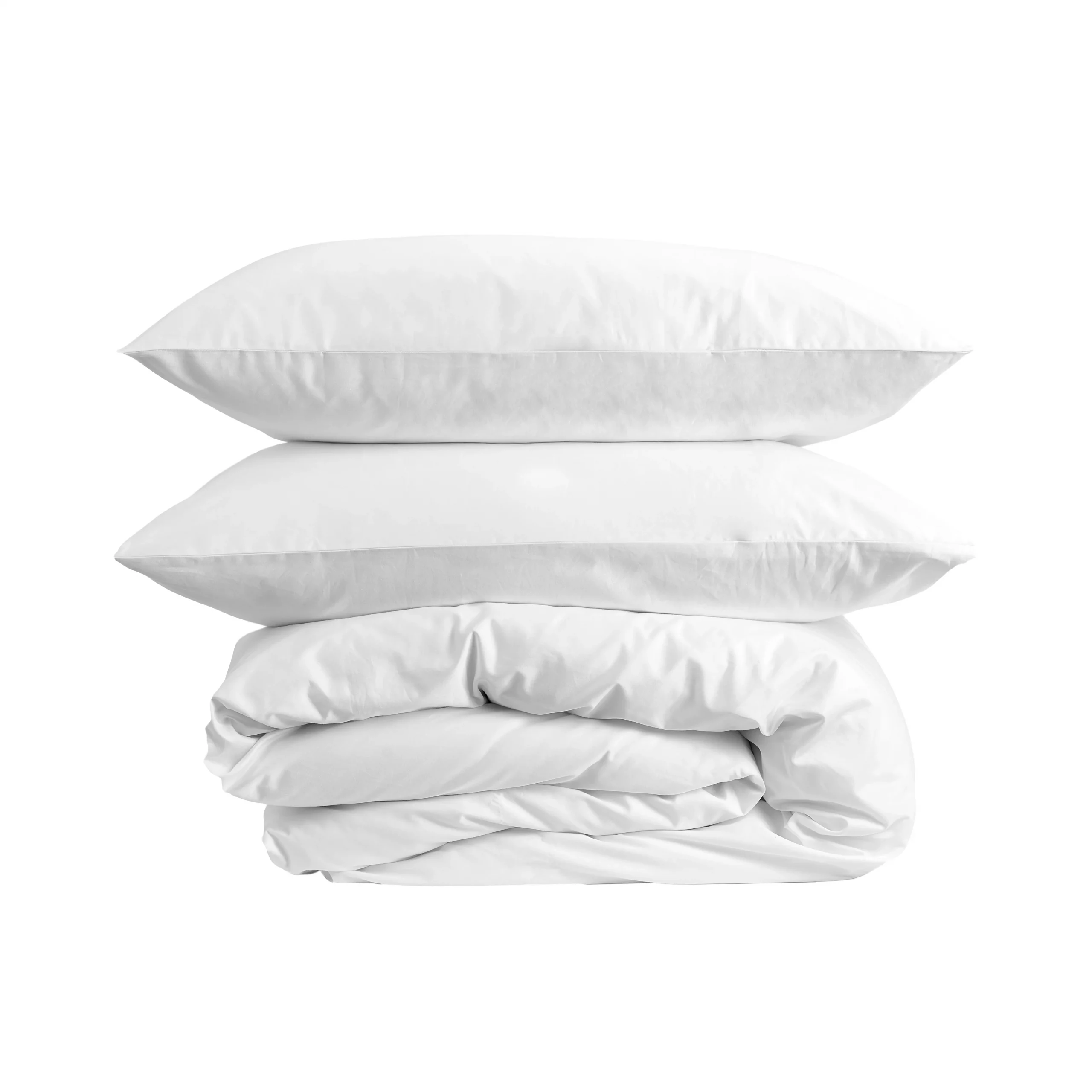 A duvet encased in a white hotel quality duvet cover with two pillows encased in Hotel Pure Luxury white pillowcases on top of it.