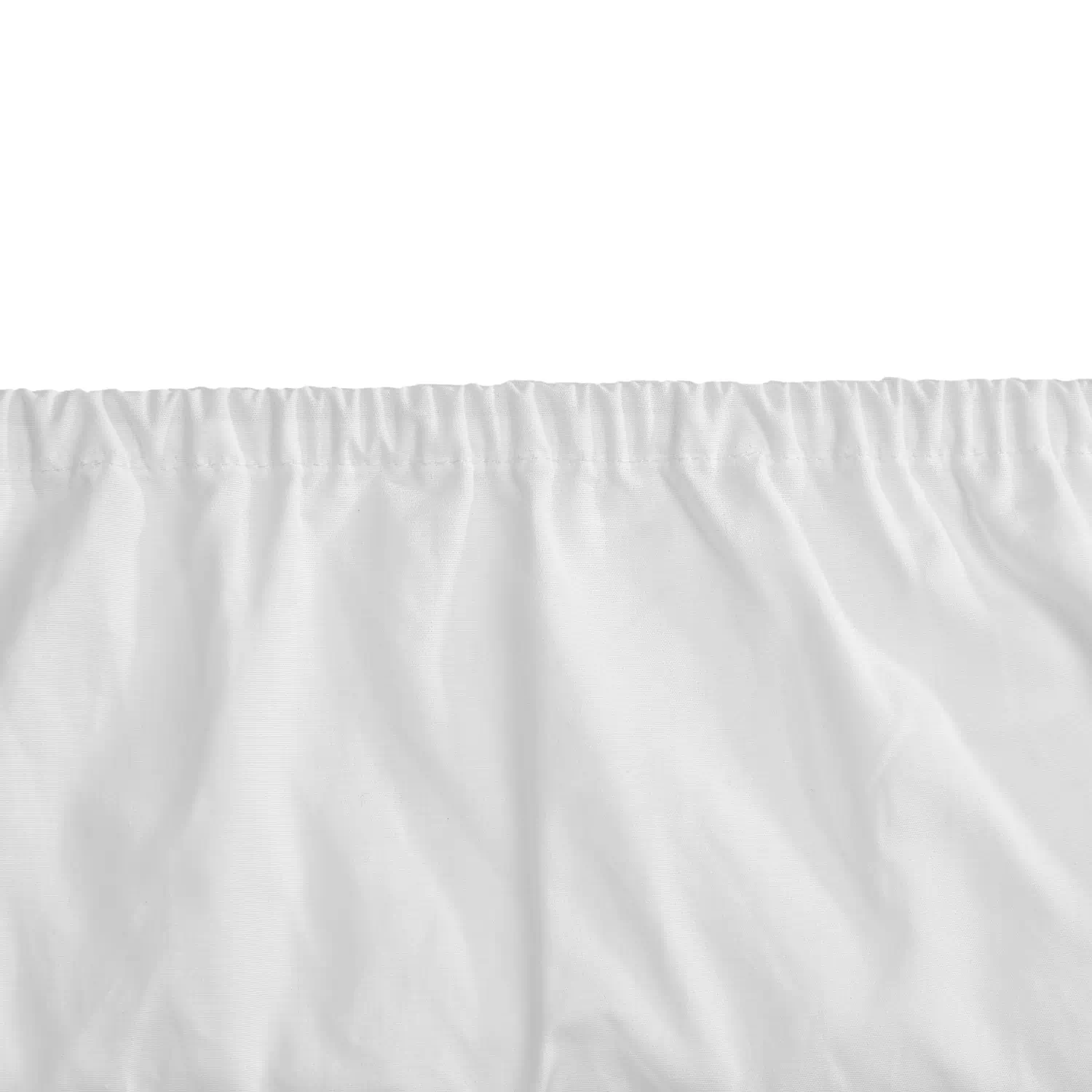 A close-up view of a Hotel Pure Luxury branded white cotton fitted sheet.