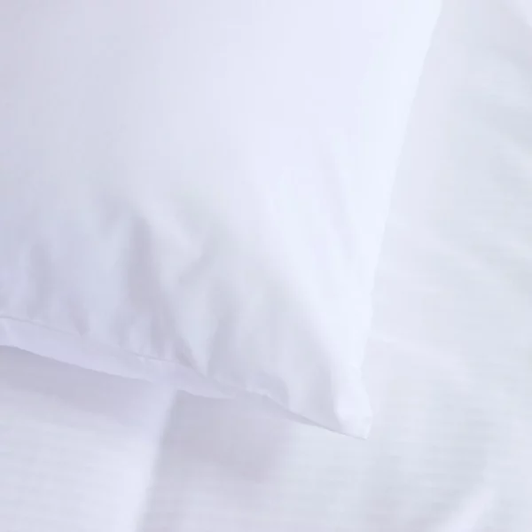 A close-up of a polycotton pillow protector from the Hotel Pure Luxury range.