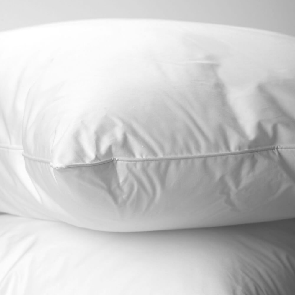 Close up of a duck feather & down white pillow