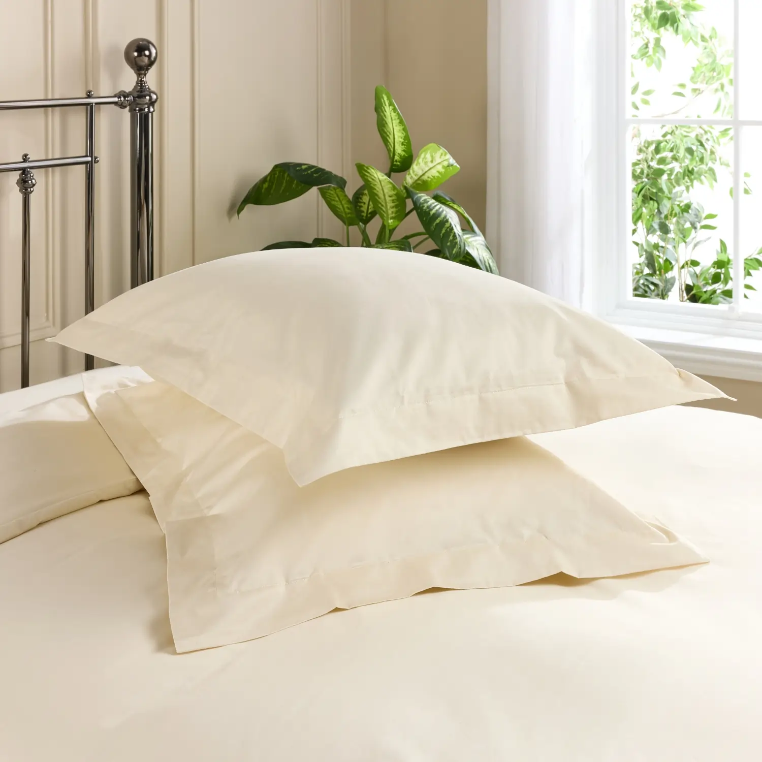 Two pillows with cream coloured Hotel Pure Luxury 480 thread count Oxford pillowcases