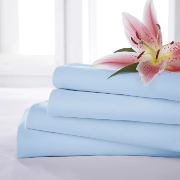 Close up of four Light Blue Martex Percale Flat Sheets stacked on one another