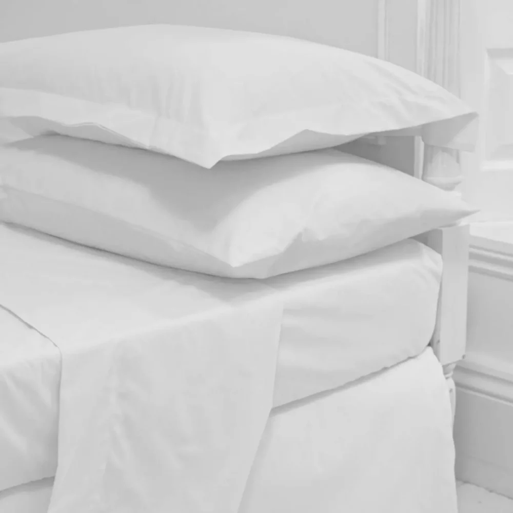 Close-up of a clearance king size polycotton flat sheet from the Vision Essentials range.