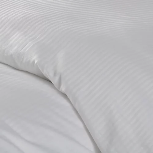 Close up detail of a polycotton satin stripe white duvet cover that's available as a clearance deal.