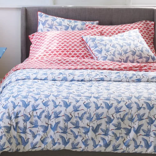 A blue patterned family of cranes duvet cover and pillowcase set