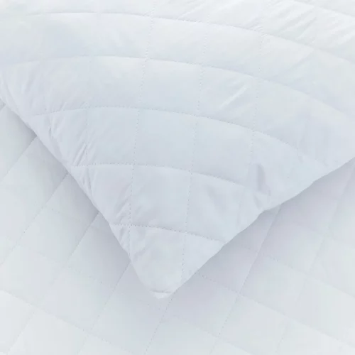 A close up view of a cotton quilted pillow protector from the Vision Essentials range.