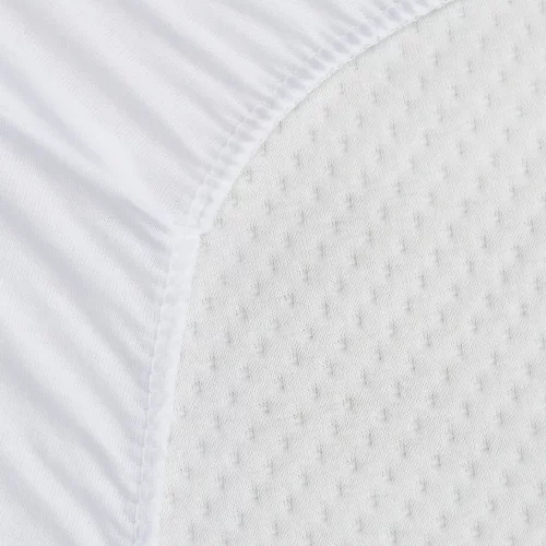 A close up of a white waterproof anti-allergy towelling cot bed mattress protector.