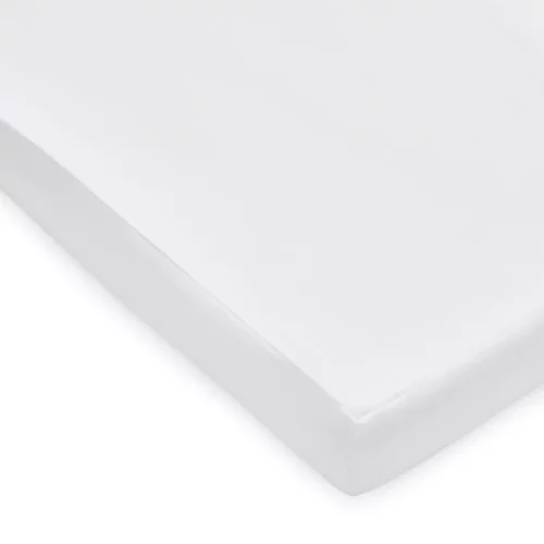 A close-up of the corner of a white anti-allergy fully enclosed mattress protector for cots from our Martex Baby range