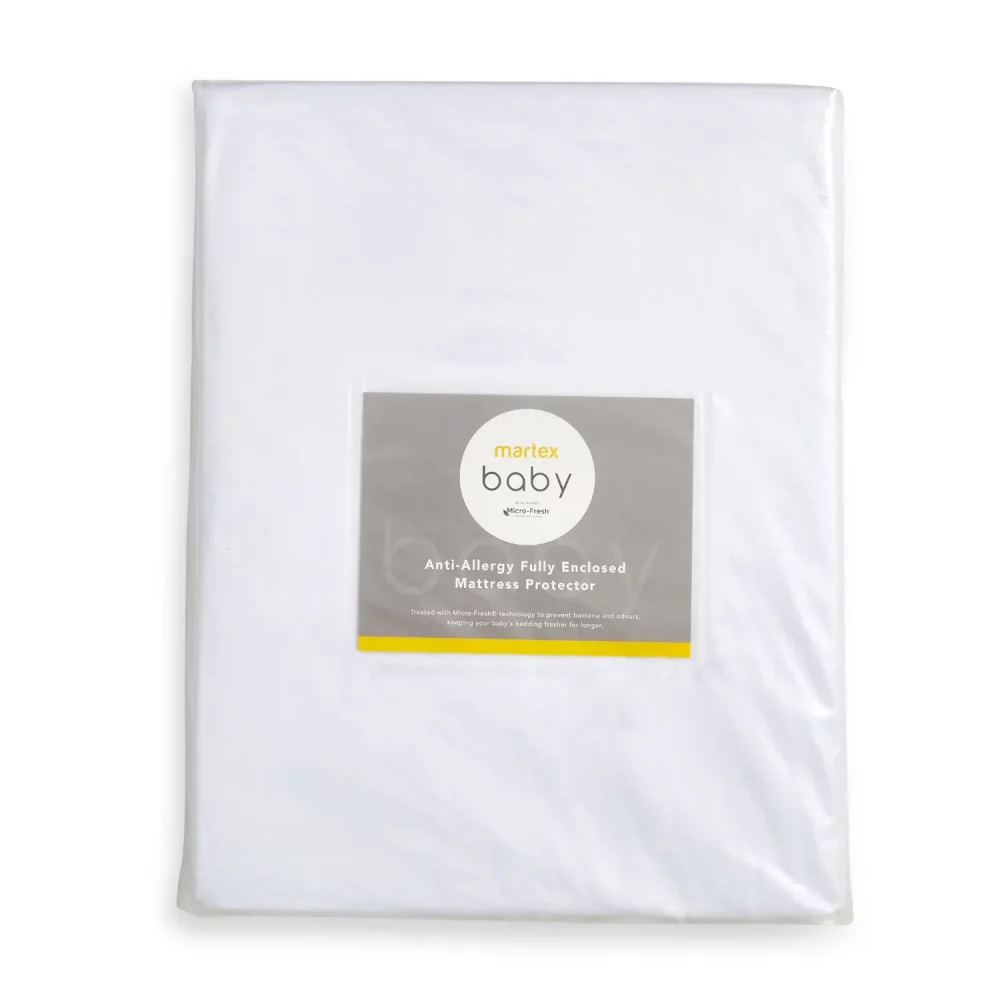 A white Martex Baby fully enclosed cot mattress protector with anti-allergy protection in its packaging