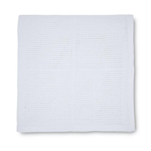 A Martex Baby white cellular blanket for use with babies.