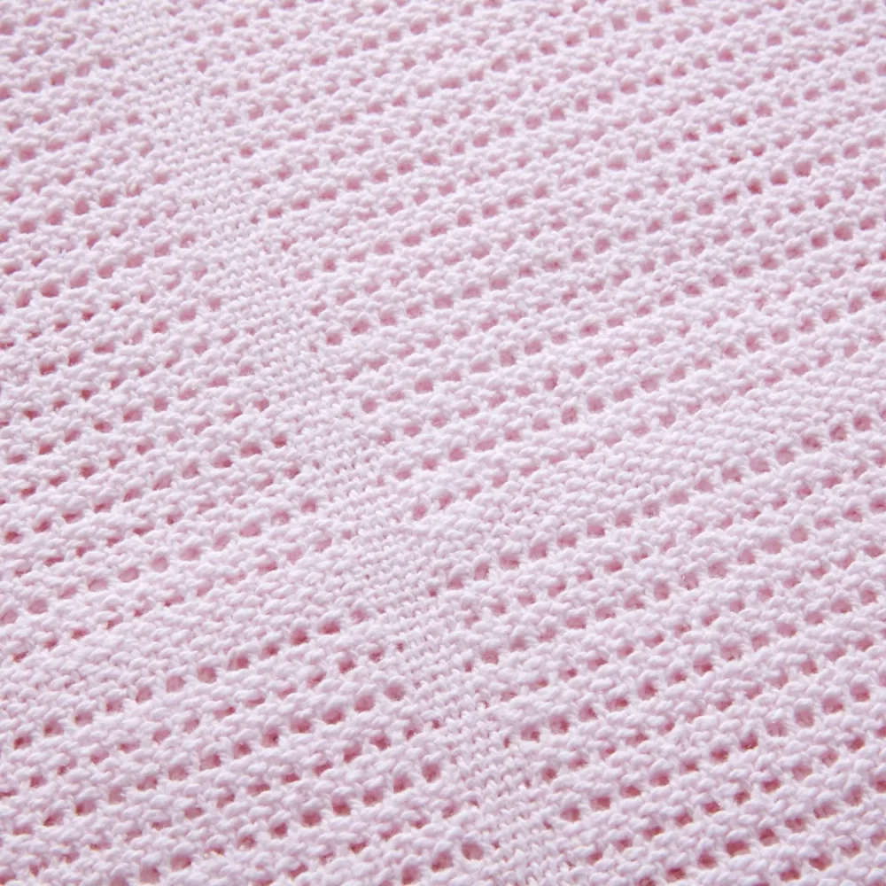 A close up of a pink Clair De Lune cotton cellular blanket