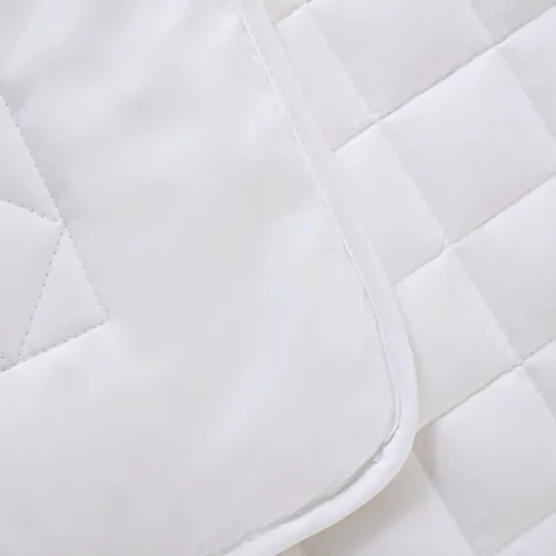 Close up of a A Clair De Lune anti-allergy 4 tog wool cot bed duvet.