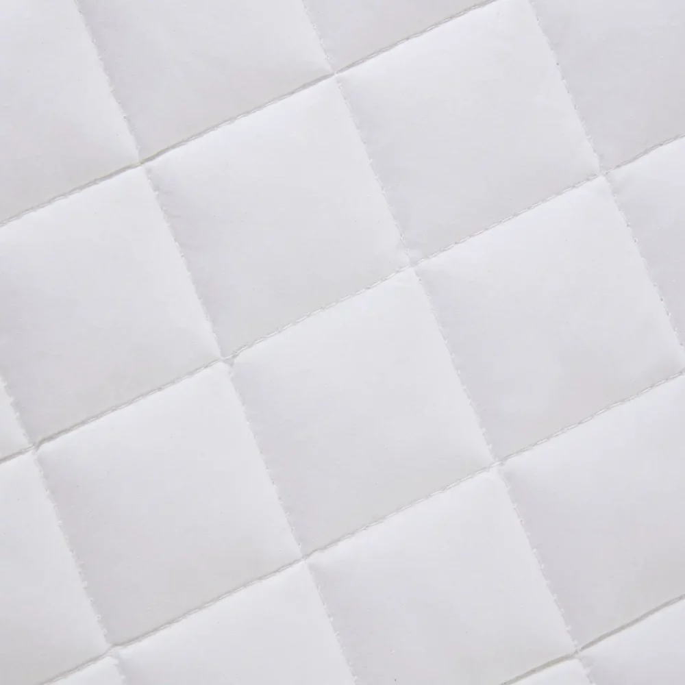 Close up of a Clair De Lune anti-allergy 4 tog wool cot bed duvet. It has a squared grid design.