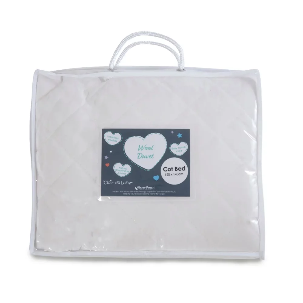 A Clair De Lune anti-allergy 4 tog wool cot bed duvet in its packaging.