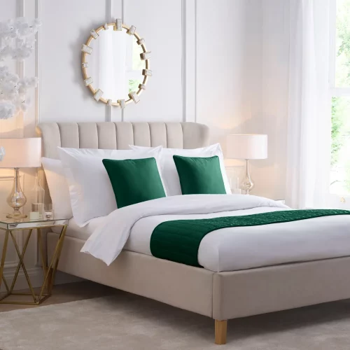 A bed with Emerald Green Velvet Piped Cushion Covers and matching bed runner