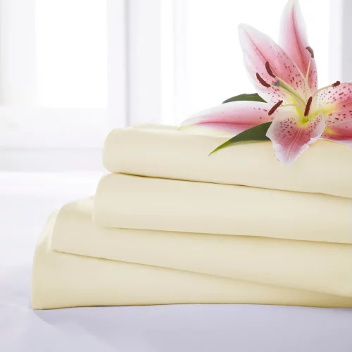 Close up of four Ivory Martex Percale Flat Sheets stacked on one another