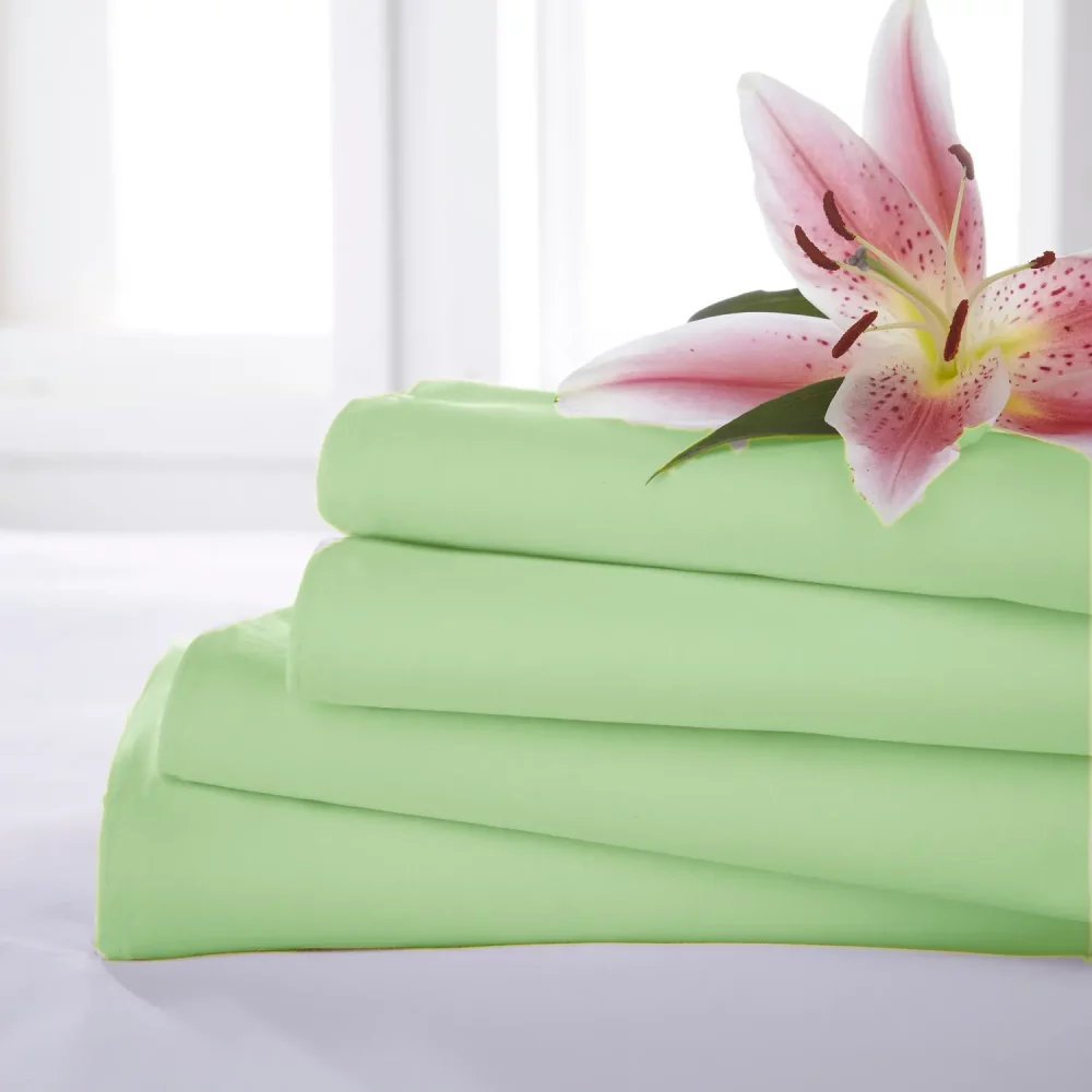 Close up of four Meadow Martex Percale Flat Sheets stacked on one another