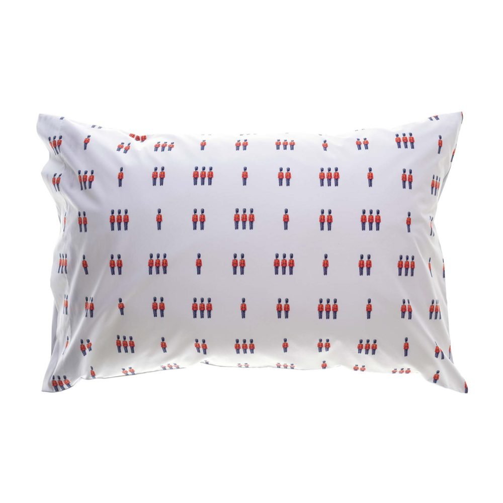 A white pillowcase from Rachel Riley. It features a print of small toy beefeater soldiers in red and blue.