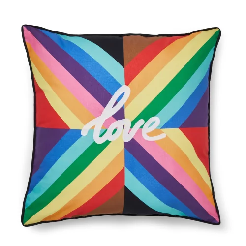 A multi-coloured rainbow cushion from Martex Pride. It has the word 'Love' in the middle of it. It's on a white background.